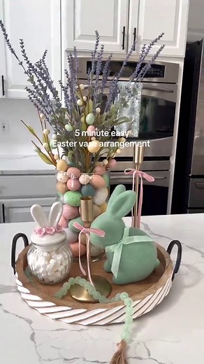 5 minutes Easy Easter glass vase arrangement 💜🌿 I love making this egg filled vase arrangements every year 🐰💚💜🌿 All you need is a glass vase, add a napkin roll in the center or a small narrow glass if you want to use fresh florals 🌷 fill with plastic eggs and arrange with long lavender stems, and some Easter egg stems🌿 let it stand alone or style it on a tray with other Easter decorations 💜 #easterdecor #springdecor #floralarrangements #springiscoming