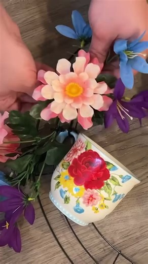 Grab a Walmart tea pot for this brilliant front door idea!