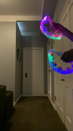 Colorful Glow Toy Dance in a Dim Room Setting