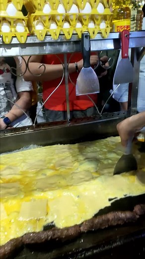 Delicious Street Food Preparation on a Griddle