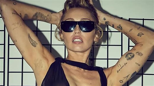Miley Cyrus goes braless and flashes her underwear in see-through dress