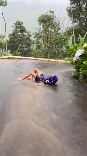 Sliding Down the Village Road in Heavy Rain! 🌧️😂 #Shorts