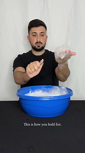 How to hold fire safely with wet hands