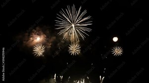 best 4K loop seamless of real shining fireworks long shot 35s for celebration background. golden glowing firework during new year's eve countdown festival in the sky display at night with colorful. Stock Video