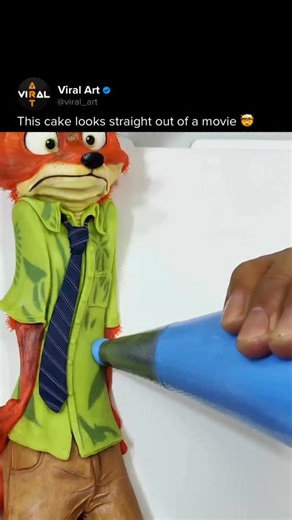 Viral Art 🎨 on Instagram: "Dede JW is a Chinese cake artist recognized for his advanced frosting and sculpting technique. He specializes in hyper-realistic cakes inspired by cartoons and animated films, transforming familiar characters into edible sculptures with impressive precision. Every element is carefully modeled in frosting — from facial expressions and proportions to surface texture and color — blurring the line between dessert and collectible figure. At first glance, his cakes feel mor