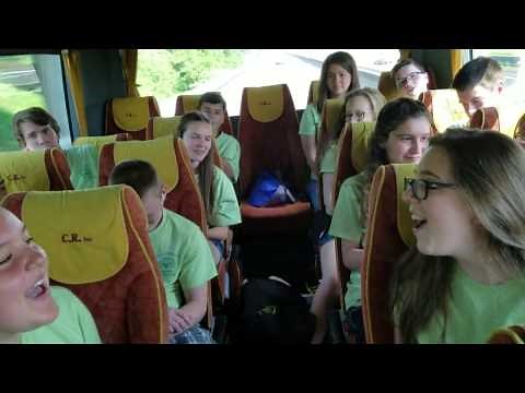 Choir on bus singing Happy Birthday to Heather