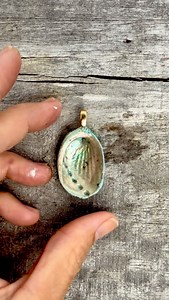 Water ‘glazing’’ the back of my handsculpted paua shell. I got inspired from the Japanese Shigaraku pottery aesthetic where natural inclusions like sand and ash are infused in clay. I added NZ beach sand fir that organic look. | Nostalgem - handmade jewellery w/ handpicked nature treasures