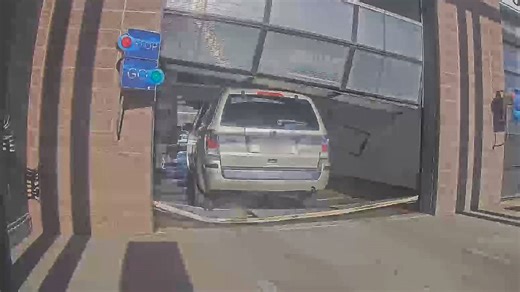 Car wash chaos: Driver crashes through bay in Montana