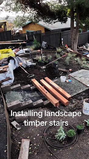 Installing landscape timber hillside stairs #construction #landscaping #build