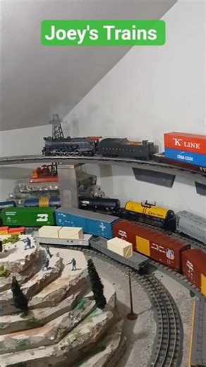 Mountain Steam Engine pulling Giant Intermodal Train.