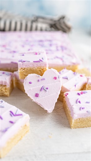 Karli | Family Food Blogger on Instagram: "Soft, chewy, and oh-so-easy, these frosted sugar cookie bars are the ultimate no-fuss dessert hack! ✨ No rolling or scooping into a bunch of cookie dough balls, just bake, frost, and slice however you prefer! 🙌 Perfect for parties, gatherings, and especially Valentine’s Day! 💕 Add festive sprinkles or a dash of almond extract for that Crumbl sugar cookie flavor. Get the full recipe, search ‘frosted sugar cookie bars’ using the link in my bio @cookingw