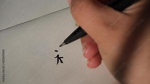 Handwritten 'Fu' on paper in Chinese characters with a black pen. It means blessing or good fortune. Concept of writing greetings for Lunar New Year, and calligraphy art. 4k Real time footage