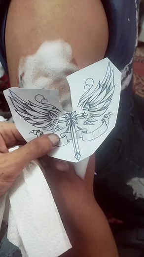 Stylized Winged Tattoo Design with 'INNOVATION' Banner
