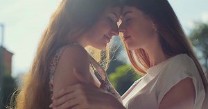 Two Young Lesbian Women Embracing  In Park Stock Footage SBV-348492419 - Storyblocks
