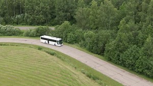 Travel White Bus Driving on Autobahn through the Woods White Bus Fast Speed Moving on Two Sided Highway. Aerial Drone Stock Video - Video of route, summer: 217084343