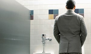 The best way to pee into a urinal, according to science