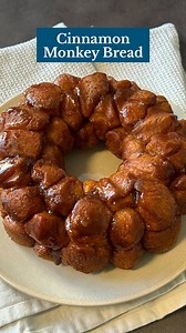 This pull-apart monkey bread is ooey, gooey, and full of cinnamon sugar goodness! Full recipe here: 4 tubes (7-1/2 ounces each) refrigerated buttermilk biscuits 1/2 cup sugar 2 teaspoons ground cinnamon 1/2 cup butter, melted 1/2 cup packed brown sugar | Taste of Home