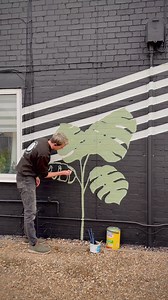 Ad 🍃🖌️🎨 What do we think of my first exterior mural?I used two Sandtex staples - Microseal Smooth Masonry Paint, in the colour Olive, and High Cover Smooth Paint, in the shade Birch - for my design, and it couldn’t have turned out better!I can’t believe I got up on that scaffold tower to paint the top 🙈 but the result is absolutely worth it. Painting brick can be tricky, so I used my sprayer for the large areas and a brush for the edges and sealed the bare brick with Sandtex stabilising solu