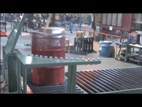 How does a drum diverter conveyor work?