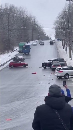 Black Ice Chaos, Dozens of Cars Slide Down Hill in Terrifying Chain Reaction