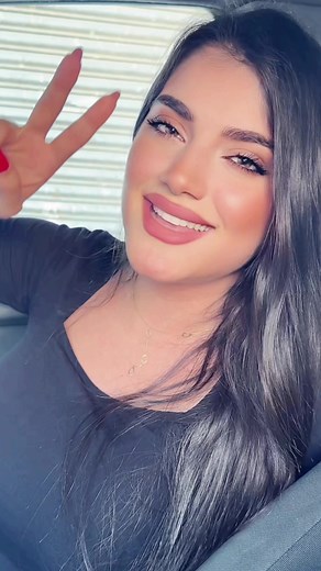 Charming Car Moment with Peace Sign Gesture