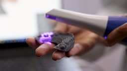 Unrecognizable woman scanning a dental model on 3D - Close up shot -...