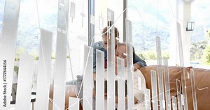 Daughter leaning over couch pointing at tablet triggers tapping and pop-up animated finance chart