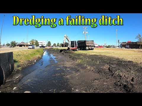 Dredging A Silted In Ditch