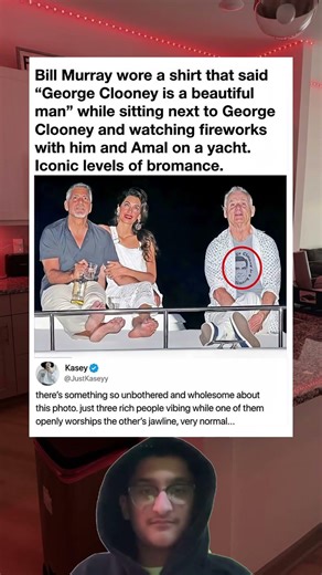 Bill Murray wore a shirt that said"George Clooney is a beautiful man" while sitting