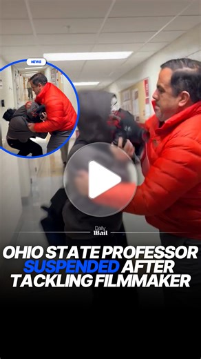 An Ohio State University assistant professor was placed on leave after footage showed him attacking a videographer on campus. Assistant Professor Luke Perez launching towards a documentarian, identified as Mike Newman, after the latter reportedly attempted to ask Vice President E. Gordon Gee a question about student loan debt. #news #trending #usa | Daily Mail Video