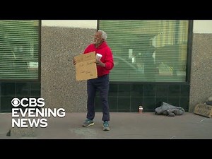 Homeless man helps hand out $100 bills to strangers