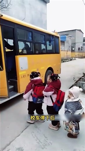 Adorable children line up for the school bus; the small scene is full of cuteness.