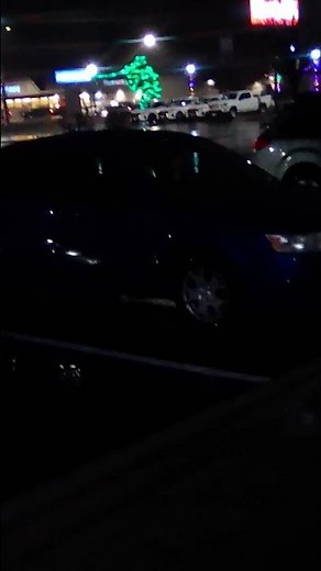 grey alien sitting in the front seat of this car looking DIRECTLY at me