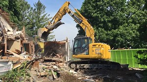 This KOBELCO beast favors houses for its main course. Would you like to spend the day demolishing structures with the SK270SRLC? Plus, this SK270 includes a blade! | Kobelco Construction Machinery USA