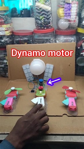 Powering LED bulbs with a dynamo motor and turned on a hand fan#Led#dc#motor #shorts