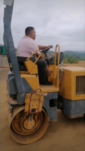 Operating a Yellow and Black Roller Compactor