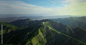 Aerial view of tourism and travel in the mountains. Beautiful nature landscape of mountain slopes and ridges. Hiking on mountain paths and roads. High quality 4k footage