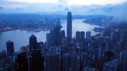 Aerial view of Hong Kong skyline at golden hour featuring IFC and ICC...