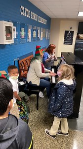 Mrs. Burford and Mrs. Willover are playing carols this morning in the lobby for students as they arrive 💙💛🎄#takingflight | Clyde Erwin Elementary Magnet School