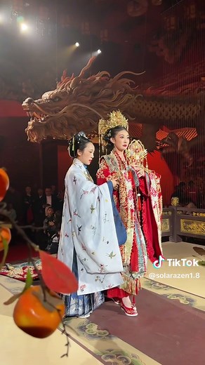 Discover China with me - A traditional Chinese wedding is a vibrant and culturally rich ceremony that symbolizes the union of two families. It often begins with a tea ceremony, where the bride and groom kneel to serve tea to their parents and elders as a sign of respect and gratitude. The wedding colors are predominantly red, symbolizing joy, prosperity, and good fortune. The bride typically wears a red qipao or wedding gown, embroidered with intricate gold patterns, while the groom may wear a t