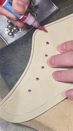 industrial sewing machine to stitch the edge of a high quality leather boot