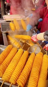 Tornado potatoes, aka twist potatoes, are a famous #streetfood in Asia, especially in China, South Korea and India. It's a deep fried spiral-cut whole potato on a skewer, brushed with various seasonings such as chili powder, honey and cheese. #Delicacy #FunChina #TwoSessions | China Plus Culture