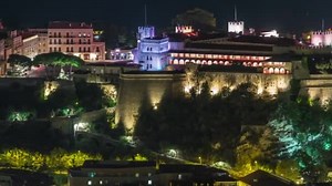 Princes Palace of Monaco illuminated by night aerial timelapse from top