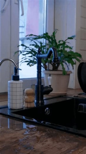 clip-4010707473-side-view-female-hands-washing-black-sink