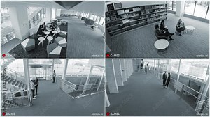 Security camera quad monitor screen interface. Surveillance camera video.