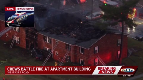 Apartment building off Westport Road catches fire after car crashes into gas line