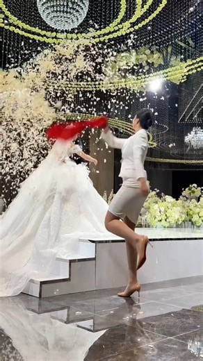 The girl ruined the wedding by throwing flowers.