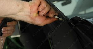 Close up of paint protection film installation on modern luxury car. PPF is polyurethane film that wrap car paint to protect paint surface from stone chips, bug splatter, and abrasion. Stock Video