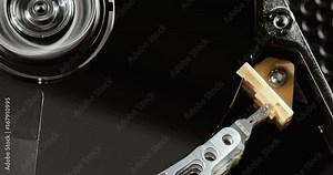 Computer techologies. data storage. Server racks, open computer hard drive. The inside of the disk, the spindle and the reading head. Storage and transfer of large information objects.