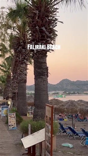 Faliraki Beach in Rhodes, Greece. A long sandy coastline with crystal clear water, beach bars and water sports for every traveler. Perfect for swimming, relaxing and enjoying summer holidays in Rhodes.